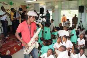 Joseph Callendar playing for the children at All Saints Primary School